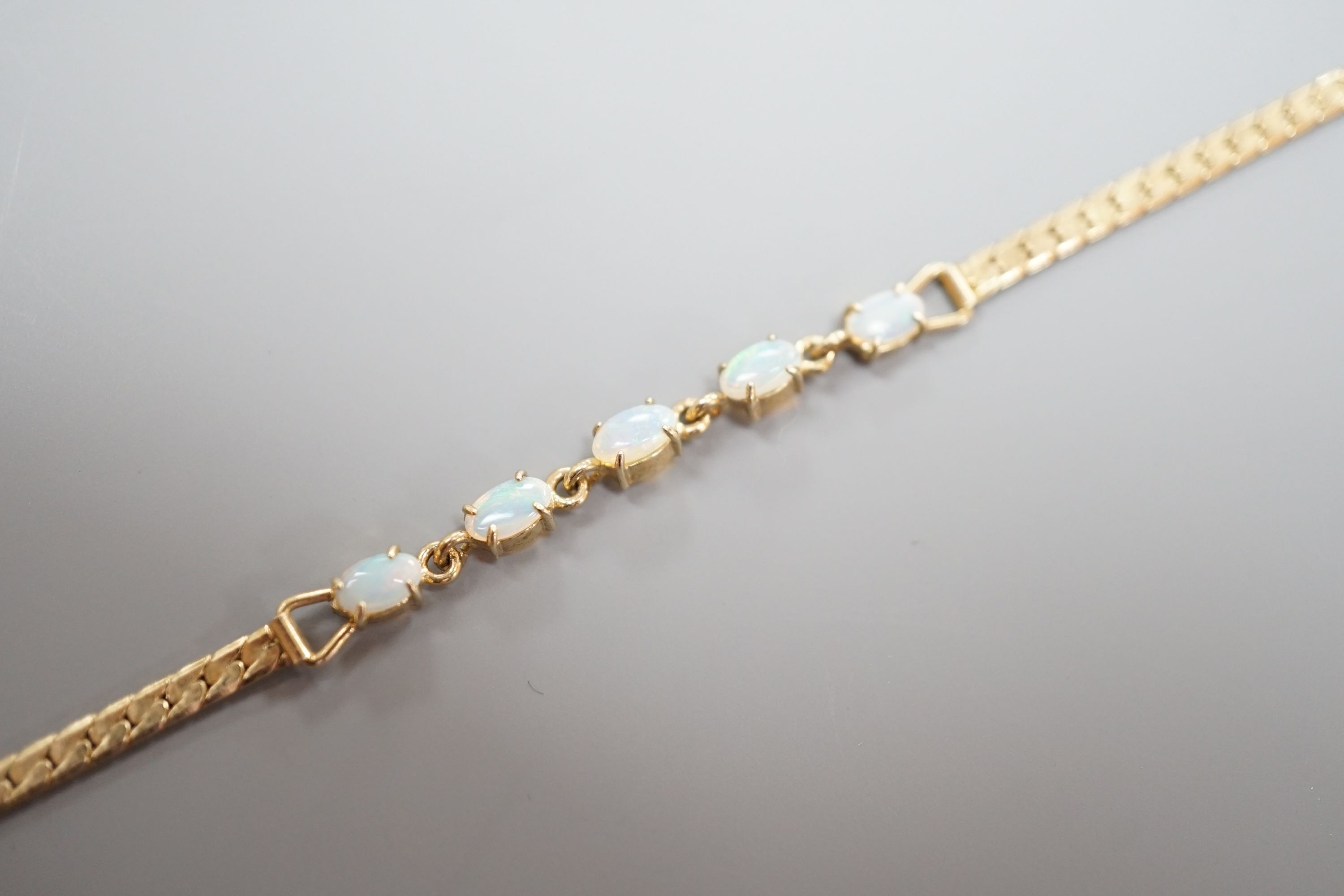 A modern gilt metal and five stone oval white opal set bracelet, 16.5cm.